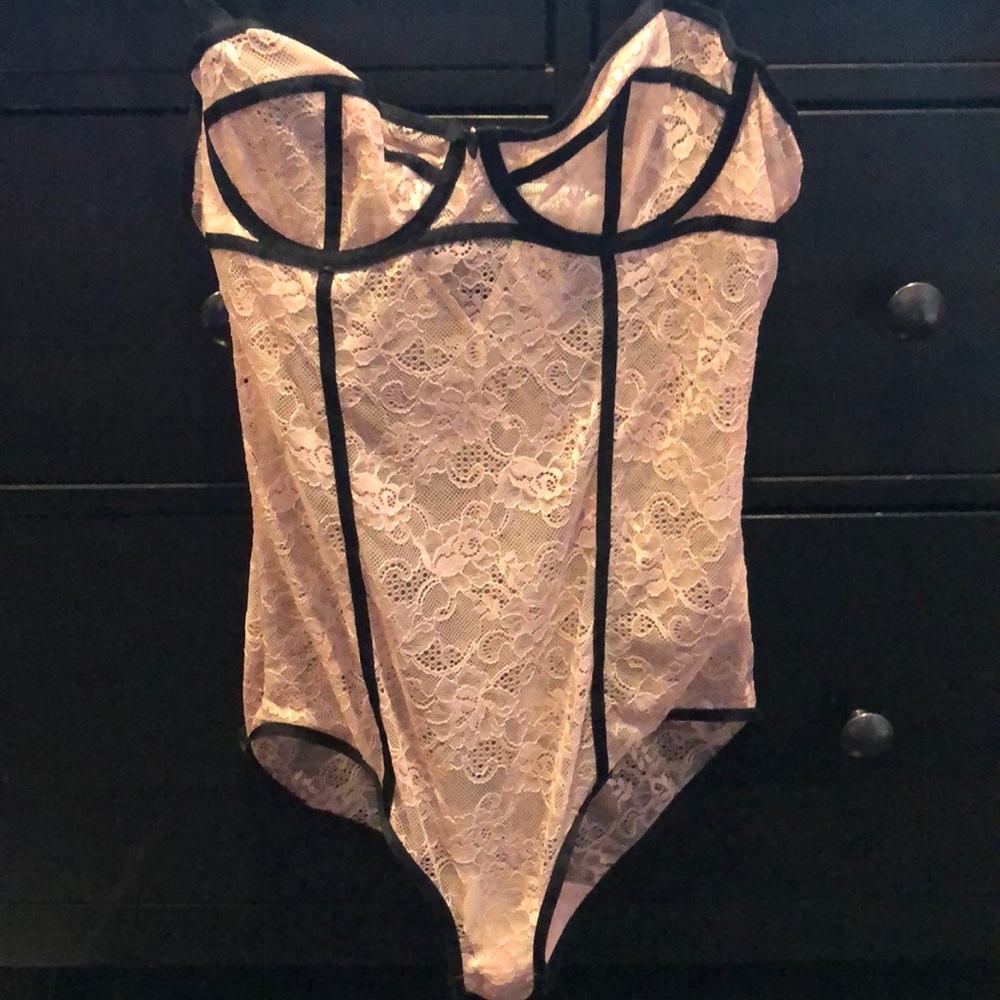 Blush and black trimmed lingerie